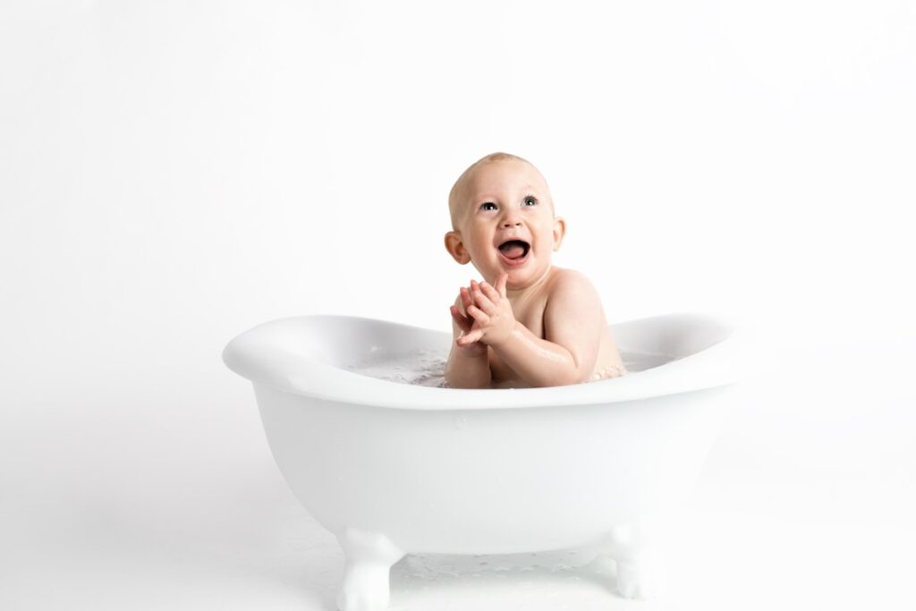 baby minimal white background in bath